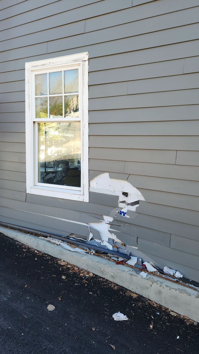 Vehicle struck the building: siding and sheathing damage