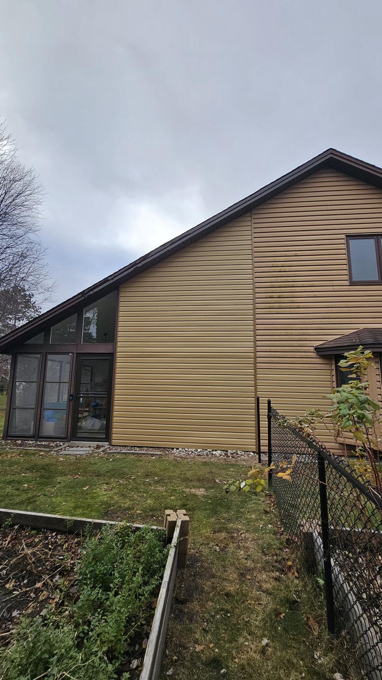After: siding matched and the chimney is gone