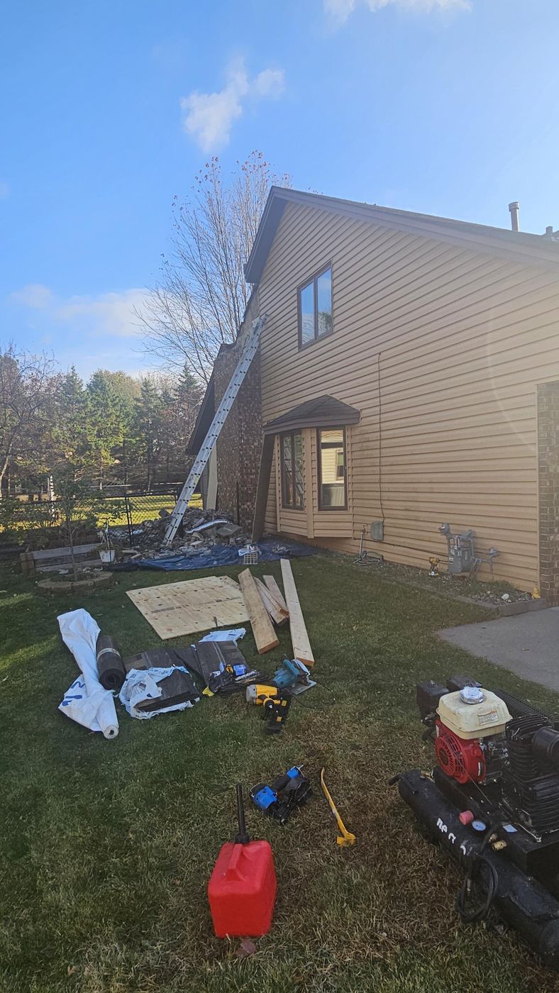 Demo in progress, sheathing and underlayment staged