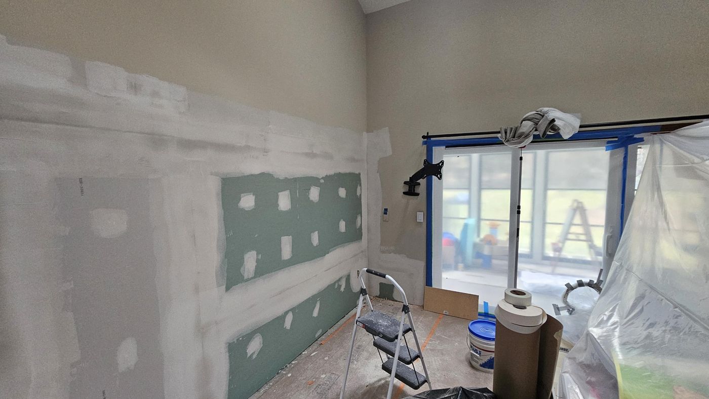 Interior wall drywalled and taped where the fireplace was