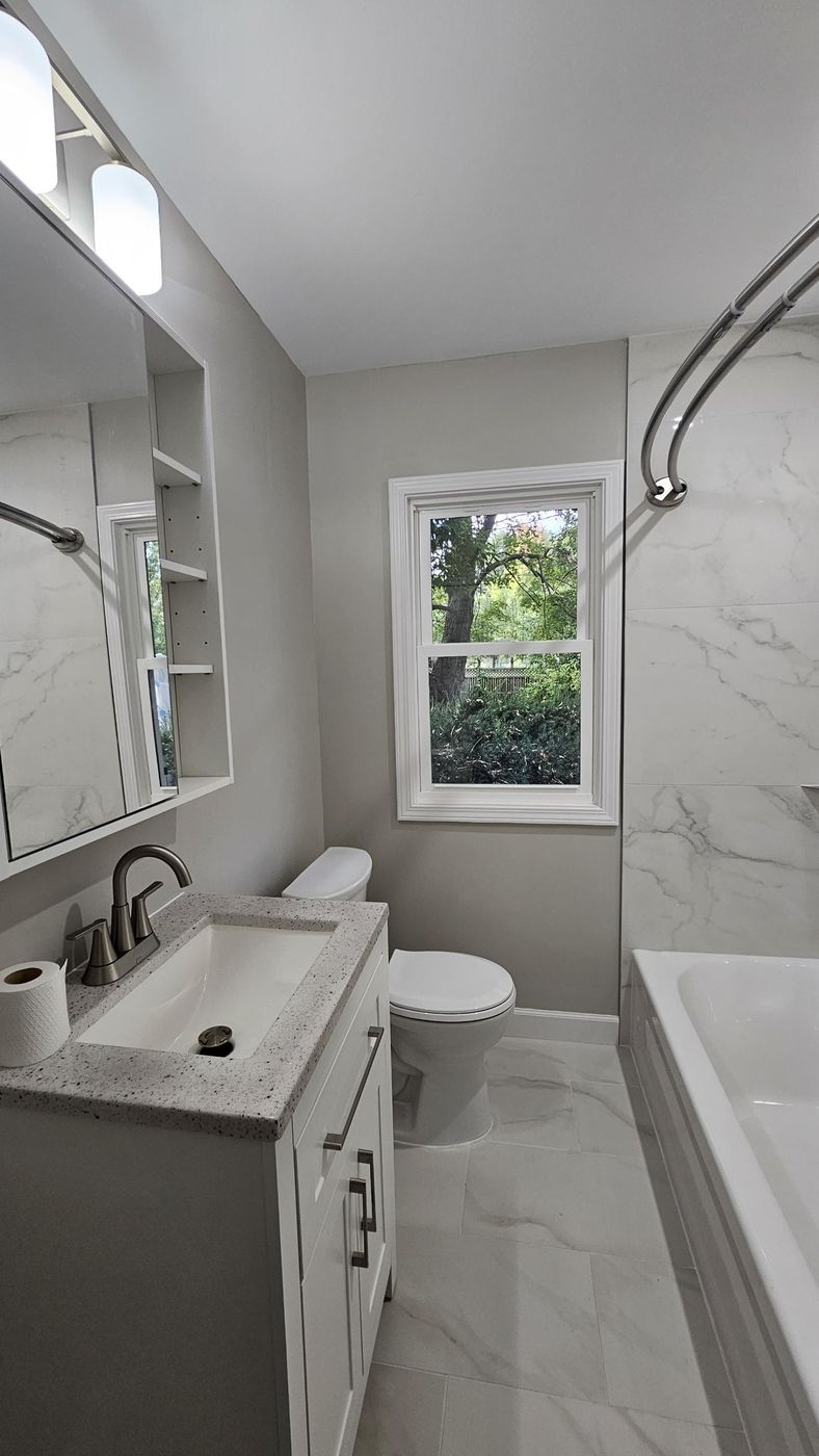 Tile surround and brushed nickel fixtures